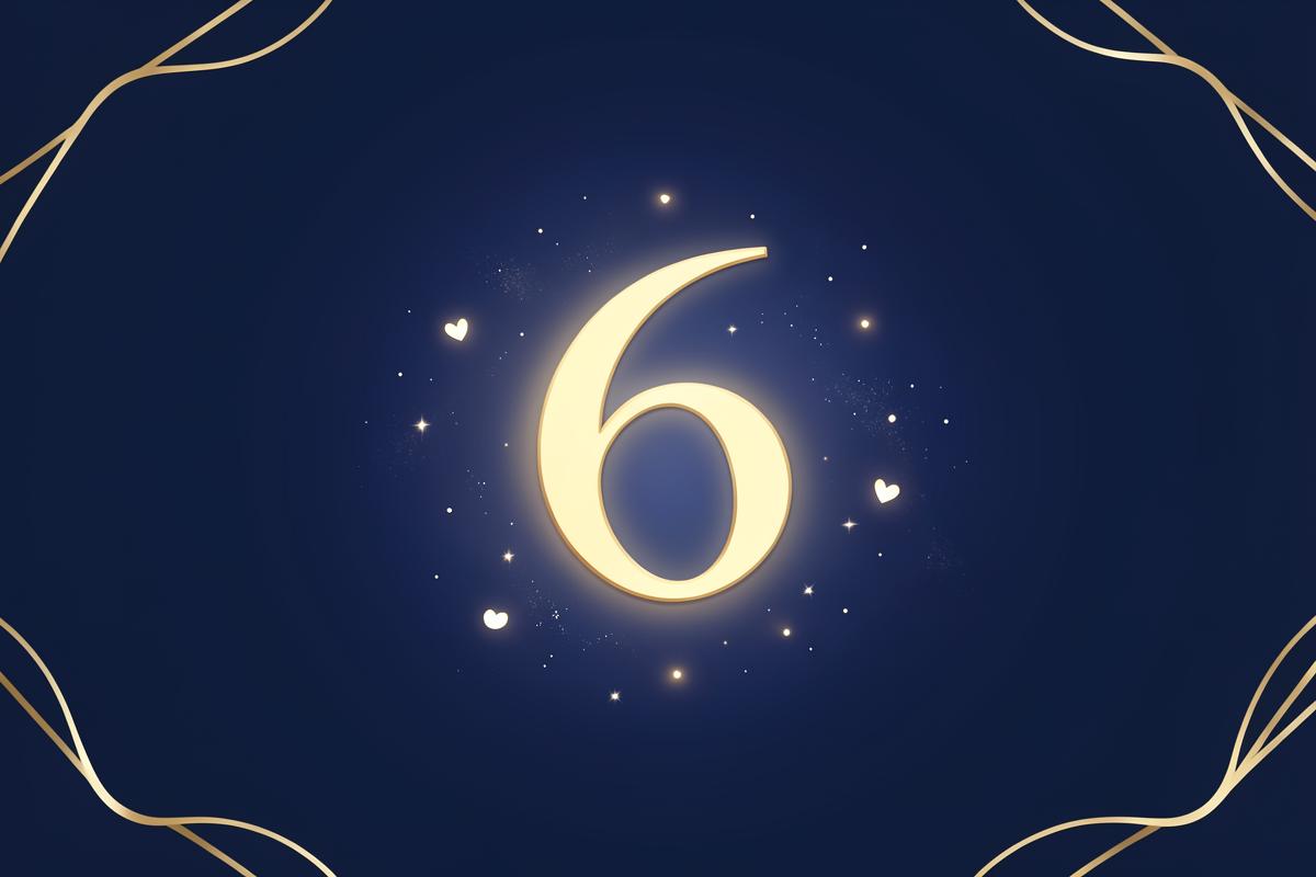Kuldsen number 6 südamekujulise valguse ja tähtedega sügaval sinisel taustal
